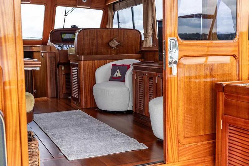Slide: The Image of 2007 Vicem 54 Classic Flybridge yacht with elegant wood interior and exterior, docked by the sea. - 32