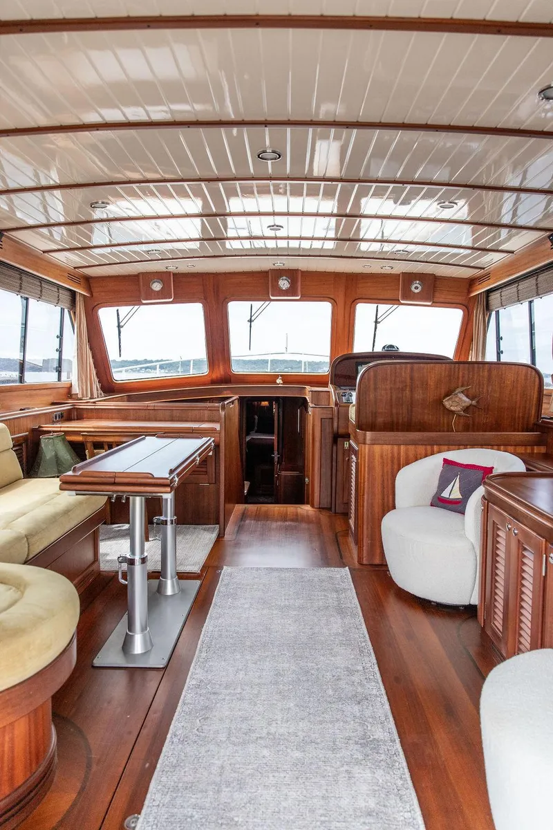 Slide: The Image of 2007 Vicem 54 Classic Flybridge interior with elegant wood finish and cream seating. - 35