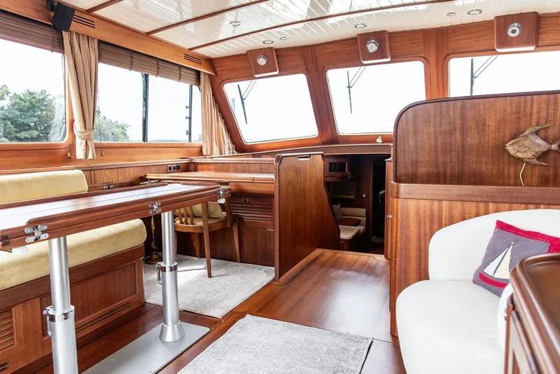 Slide: The Image of Helm of 2007 Vicem 54 Classic Flybridge with dual navigation screens and wooden steering wheel. - 38