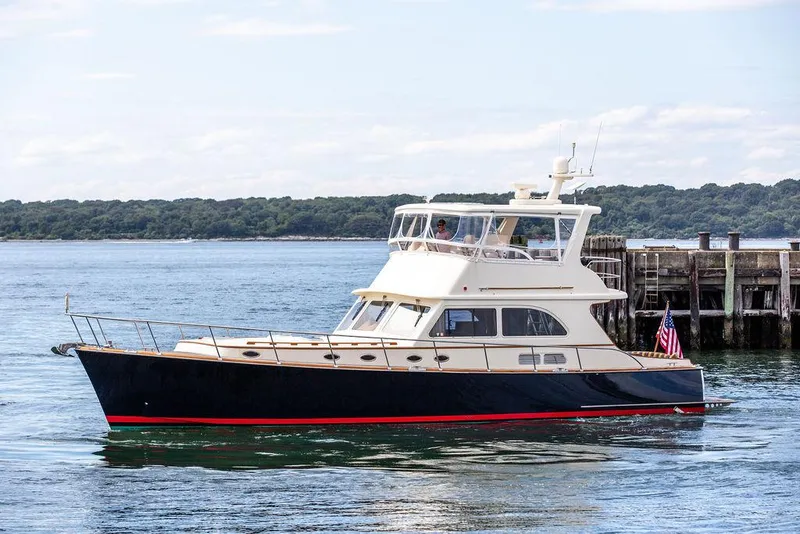 Slide: The Image of 2007 Vicem 54 Classic Flybridge yacht on calm water, side view. - 5