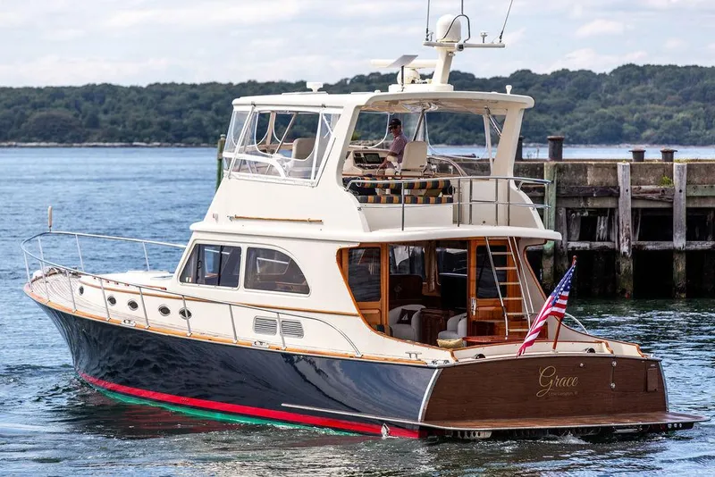 Slide: The Image of 2007 Vicem 54 Classic Flybridge yacht cruising on a scenic waterway. - 6