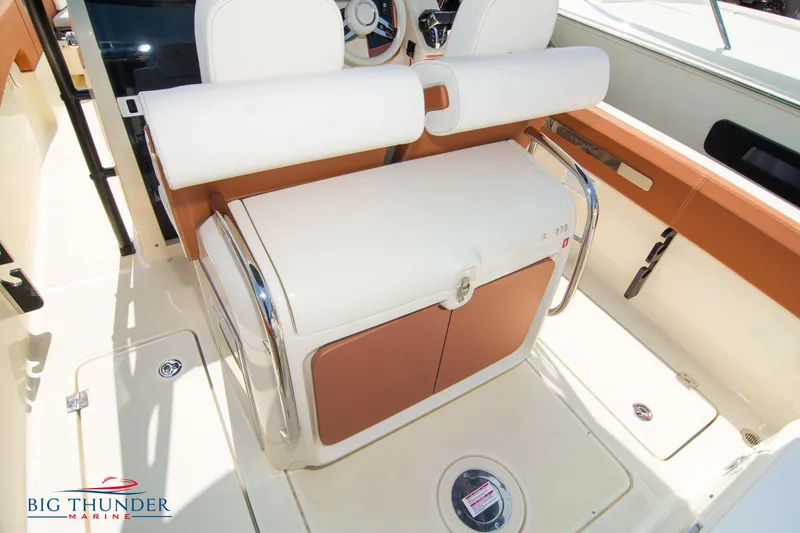 Slide: The Image of 2024 Capoforte FX270 boat interior with seating and storage, featuring modern design elements. - 14