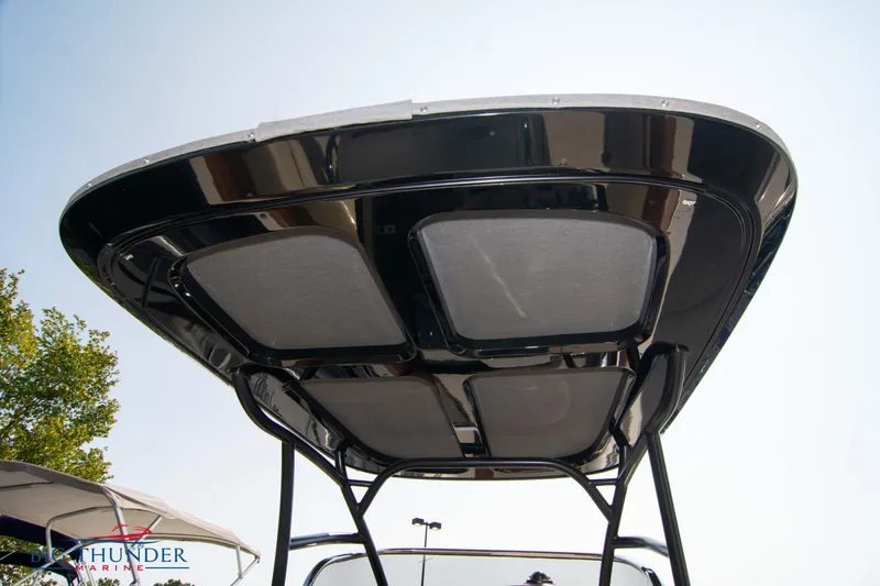 Slide: The Image of 2024 Capoforte FX270 boat canopy, sleek design, viewed from below against clear sky. - 18