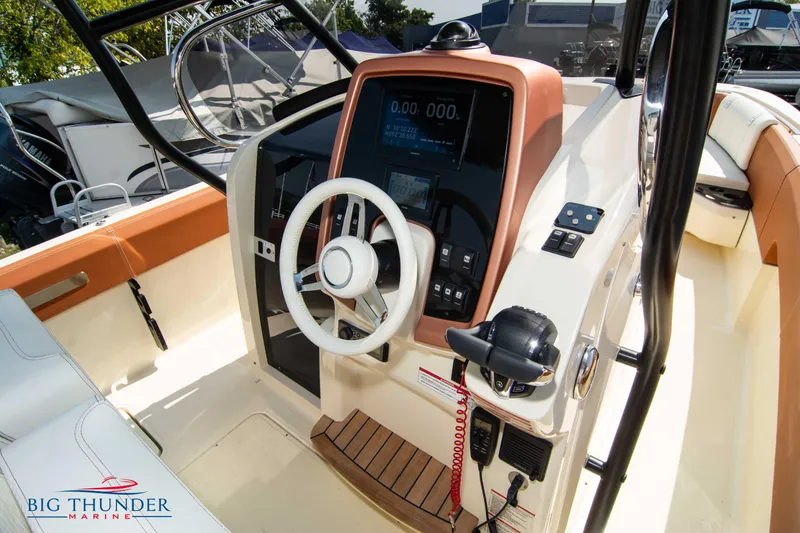 Slide: The Image of 2024 Capoforte FX270 boat cockpit with steering wheel and control panel. - 23