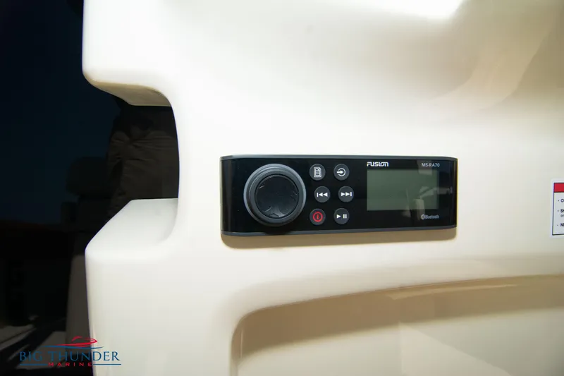 Slide: The Image of 2024 Capoforte FX270 boat control panel with Fusion audio system. - 29