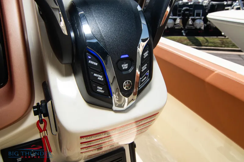 Slide: The Image of Control panel of 2024 Capoforte FX270 boat with start/stop button and various controls. - 33