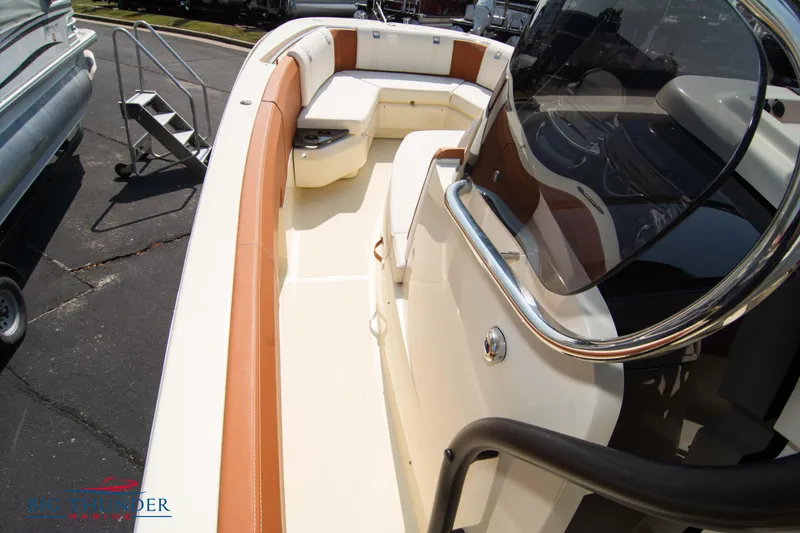 Slide: The Image of 2024 Capoforte FX270 boat interior with tan and white seating, sleek design. - 37