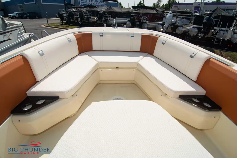 Slide: The Image of 2024 Capoforte FX270 boat interior with cushioned seating and cup holders. - 41