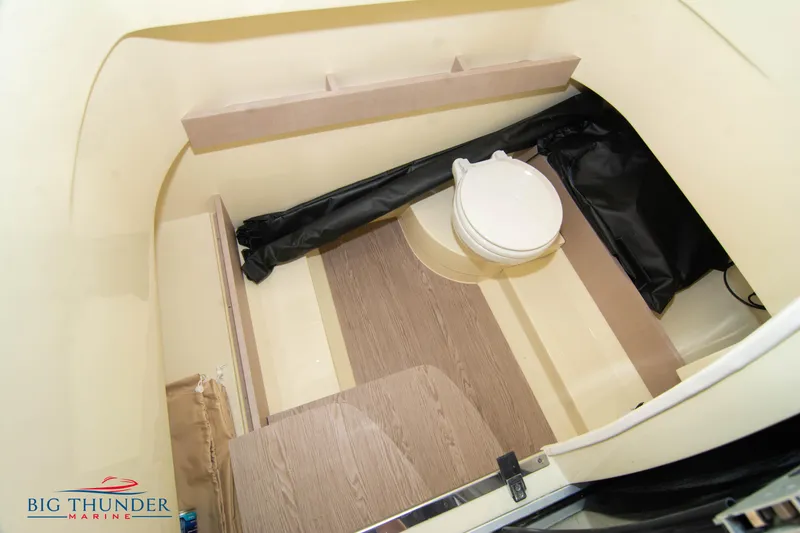 Slide: The Image of 2024 Capoforte FX270 boat interior with toilet and wood flooring. - 47