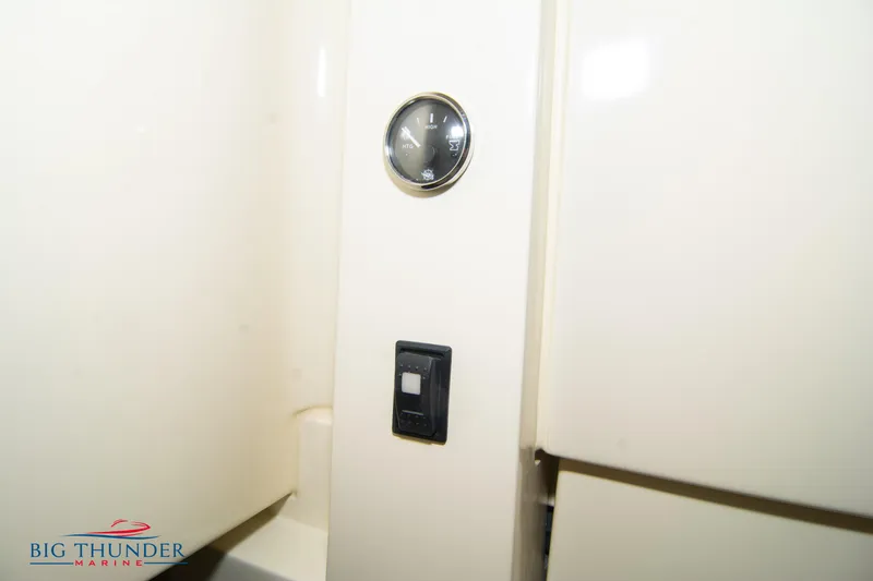 Slide: The Image of 2024 Capoforte FX270 interior detail with gauge and switch, Big Thunder Marine logo. - 48