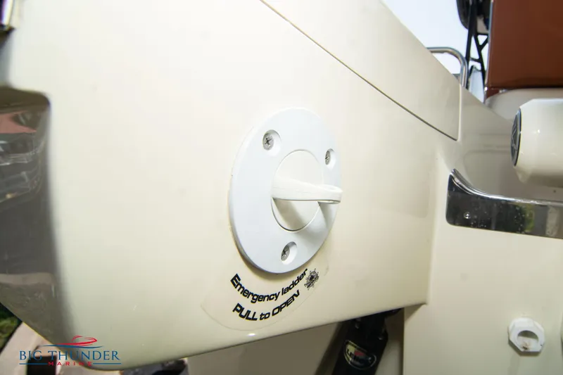 Slide: The Image of 2024 Capoforte FX270 emergency lever detail on boat exterior. - 6