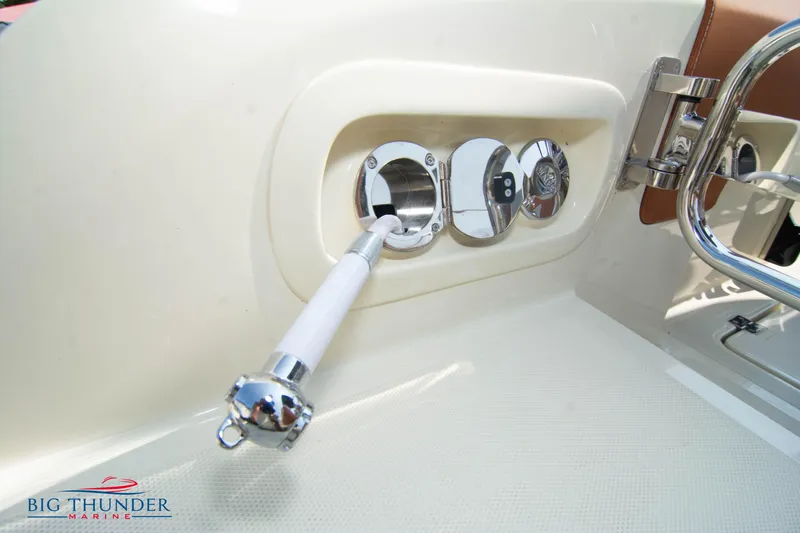 Slide: The Image of 2024 Capoforte FX270 boat control panel with chrome details and handle. - 9