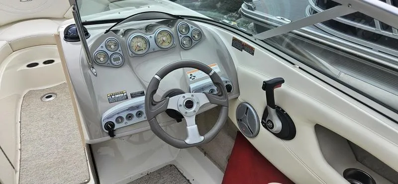 Slide: The Image of 2007 Maxum 2200 SR3 boat dashboard with steering wheel and control panel. - 10