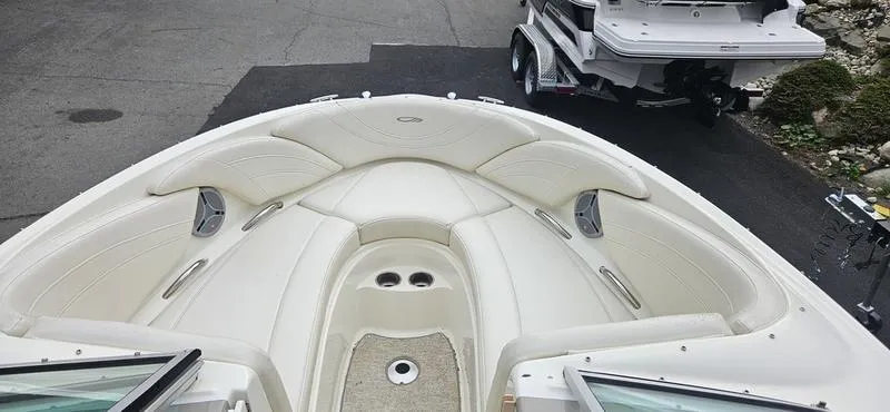 Slide: The Image of 2007 Maxum 2200 SR3 boat interior with white seating and cup holders. - 8