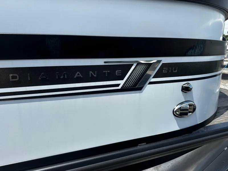 Slide: The Image of 2023 Viaggio Diamante 21U boat exterior with sleek design and branding. - 14
