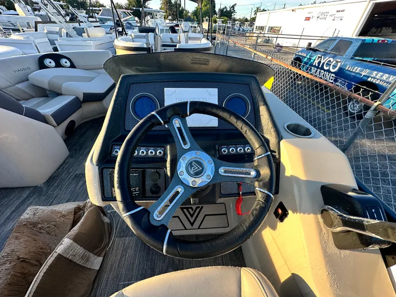 Slide: The Image of Viaggio Diamante 21U 2023 boat dashboard with steering wheel and control panel. - 8