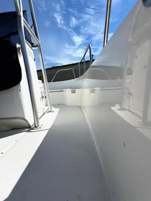 Slide: The Image of 2017 Boston Whaler 210 Montauk boat deck under clear blue sky. - 14