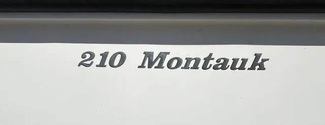 Slide: The Image of Boston Whaler 210 Montauk 2017 model nameplate on boat exterior. - 2
