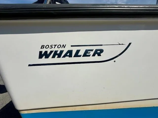 Slide: The Image of Boston Whaler 210 Montauk 2017 boat logo on white hull. - 3