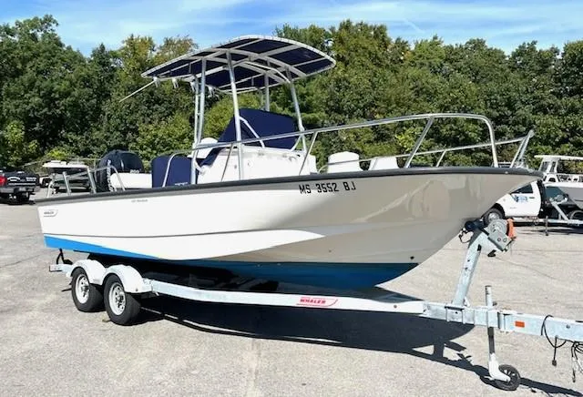 Slide: The Image of 2017 Boston Whaler 210 Montauk boat on trailer, parked outdoors. - 4