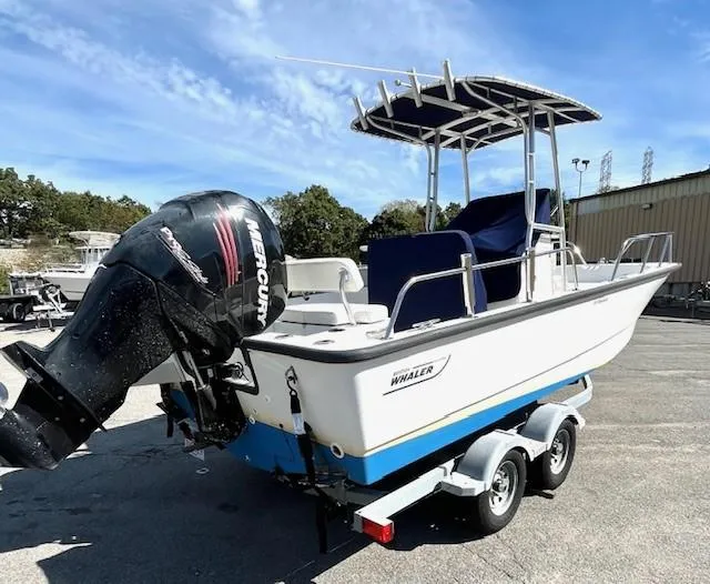 Slide: The Image of 2017 Boston Whaler 210 Montauk boat on trailer with Mercury outboard motor. - 6