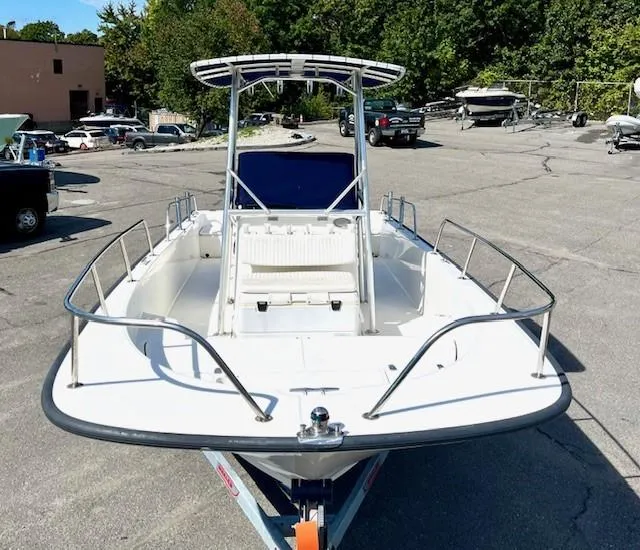 Slide: The Image of 2017 Boston Whaler 210 Montauk boat on trailer in parking lot. - 9
