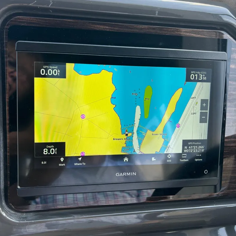 Slide: The Image of Garmin navigation display on 2017 Sea Ray Sundancer 260 showing nautical map and GPS data. - 25