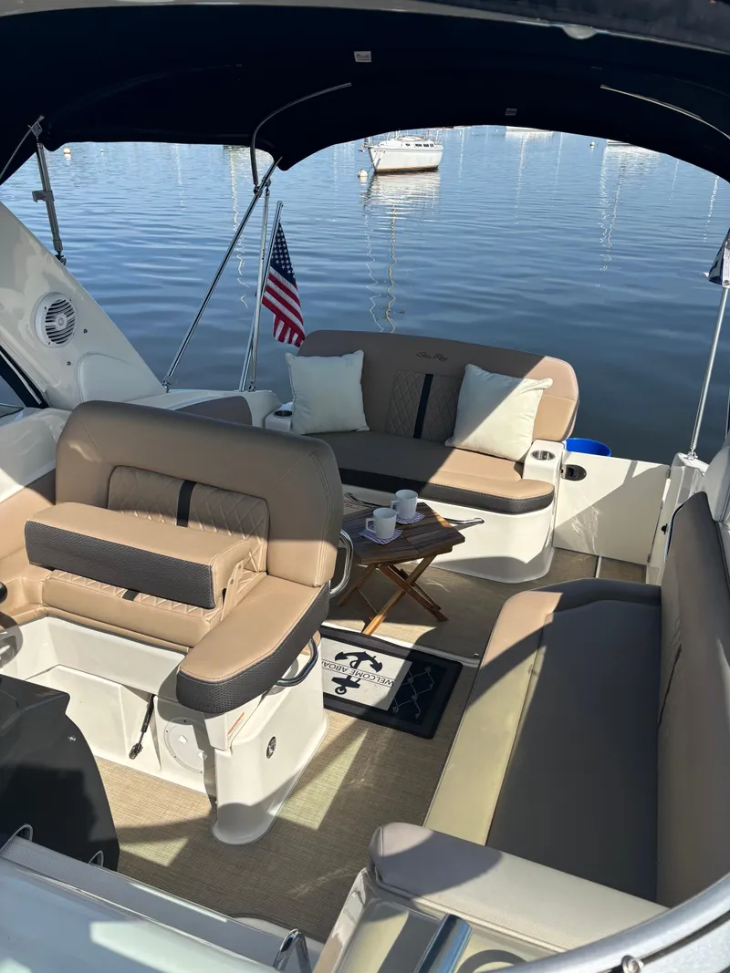 Slide: The Image of 2017 Sea Ray Sundancer 260 interior with seating, table, and lake view. - 9
