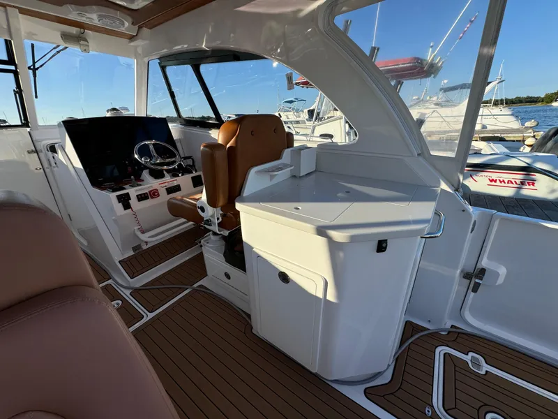 Slide: The Image of Interior of 2020 Southport 33 DC boat with helm and seating area. - 13