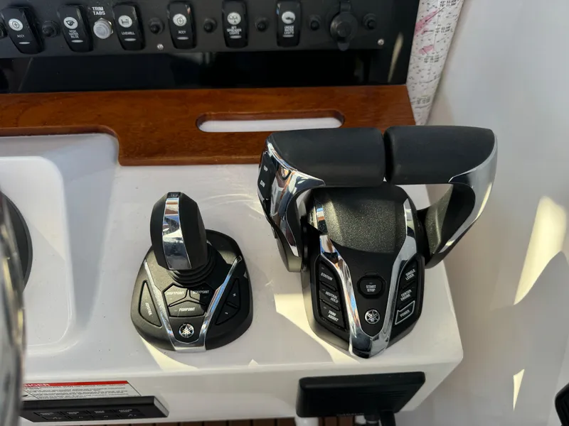 Slide: The Image of Control panel of 2020 Southport 33 DC boat with joystick and throttle. - 22