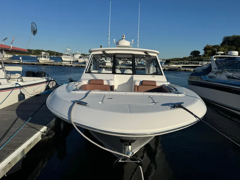 Slide: The Image of 2020 Southport 33 DC boat docked at marina, front view. - 3