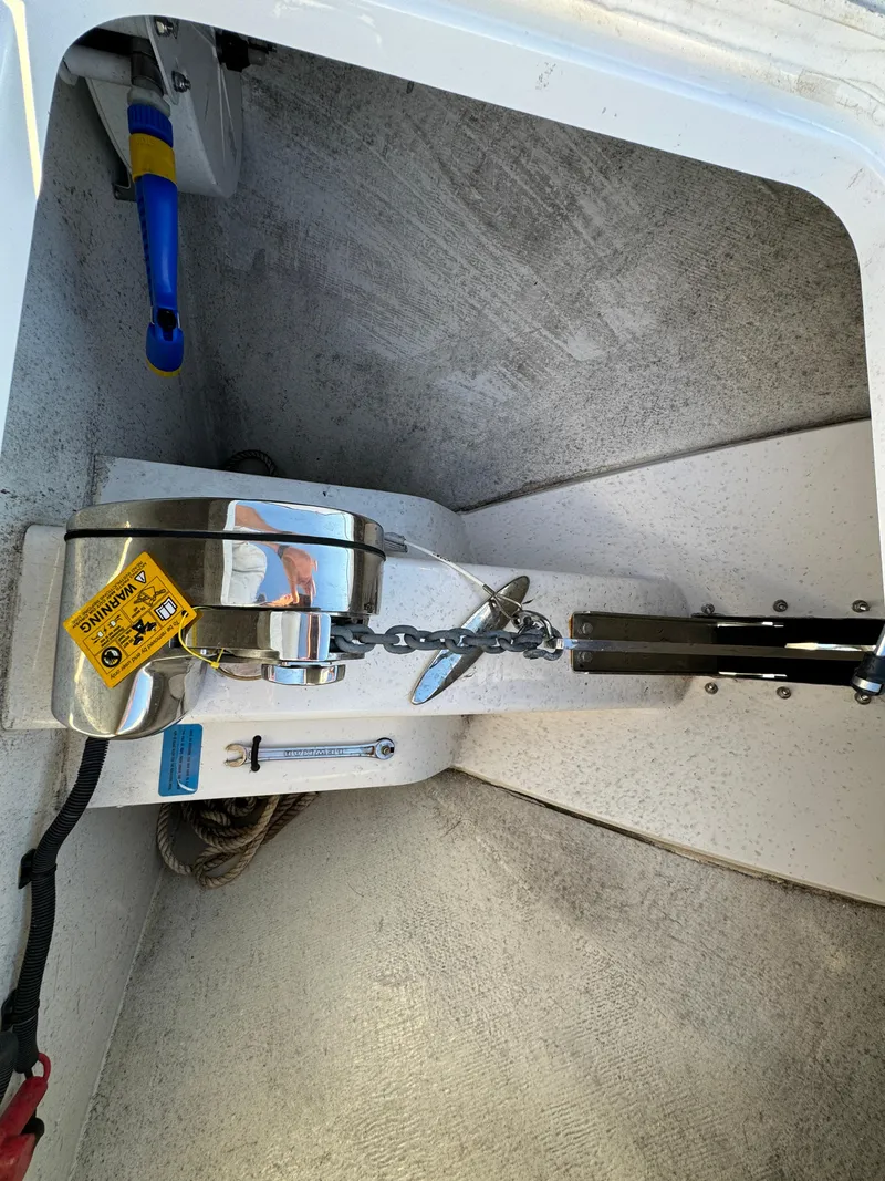 Slide: The Image of Anchor compartment of 2020 Southport 33 DC boat with chain and safety equipment. - 35
