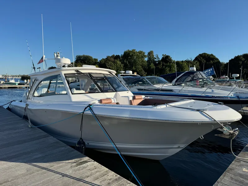 Slide: The Image of 2020 Southport 33 DC boat docked at marina under clear blue sky. - 4