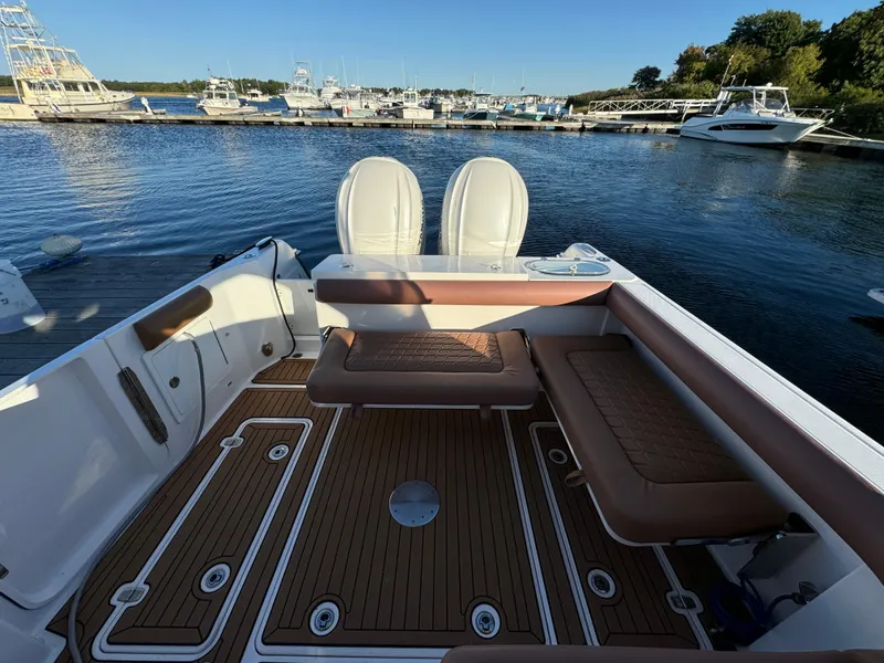 Slide: The Image of 2020 Southport 33 DC boat interior with seating, docked at marina. - 7