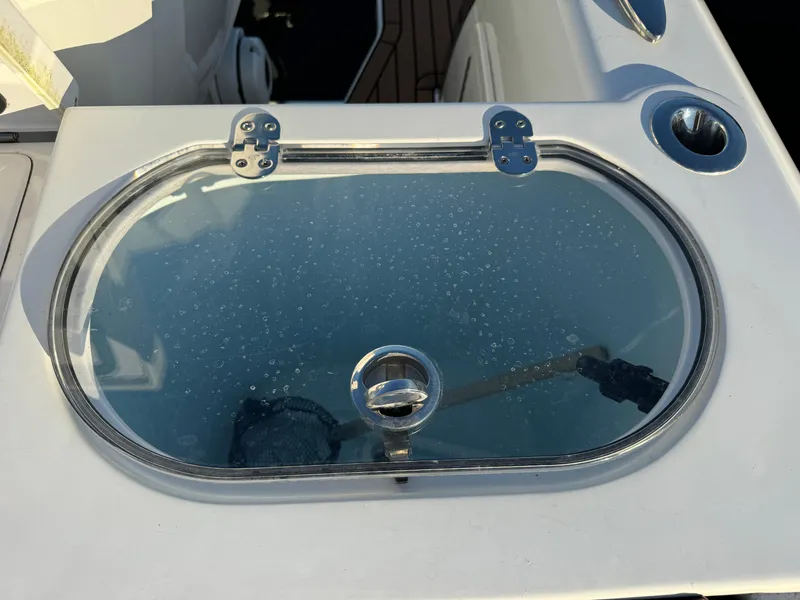 Slide: The Image of 2020 Southport 33 DC boat with a closed oval hatch on the deck. - 9