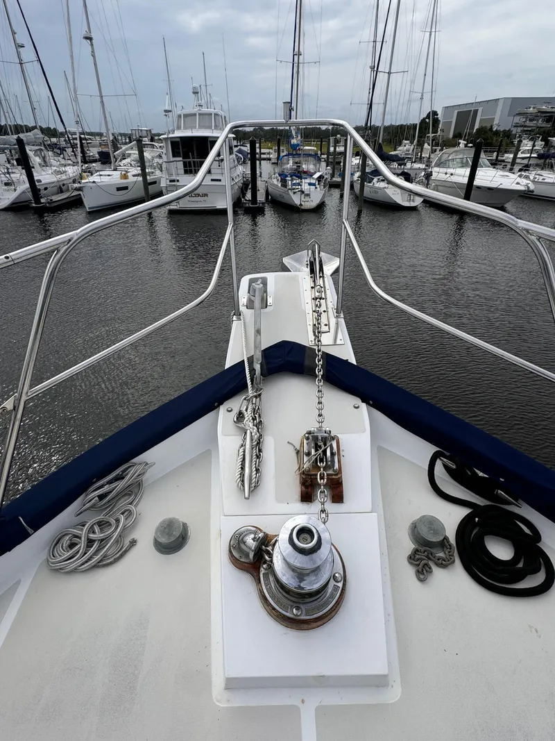 Slide: The Image of Bow view of 1996 Kadey-Krogen 48 yacht docked in a marina. - 19
