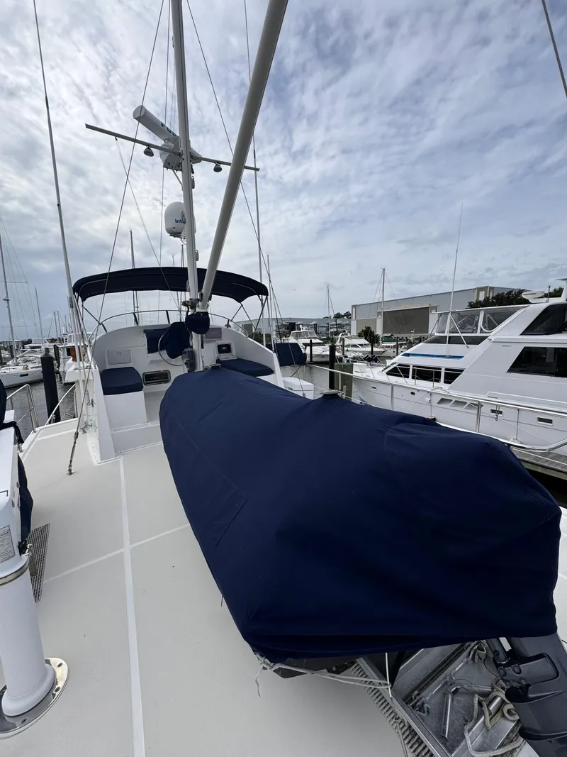 Slide: The Image of Kadey-Krogen 48 yacht, 1996 model, docked with covered equipment on deck. - 24