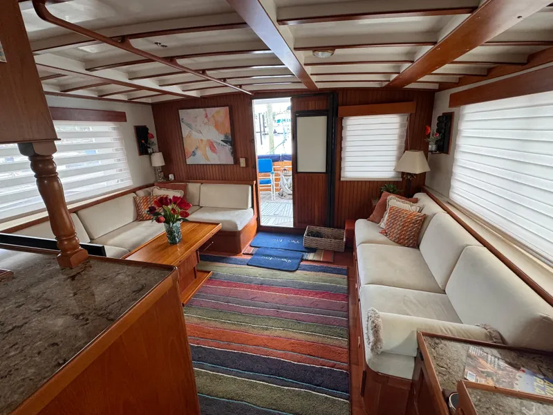 Slide: The Image of Luxurious 1996 Kadey-Krogen 48 yacht interior with cozy seating, colorful rug, and elegant decor. - 33