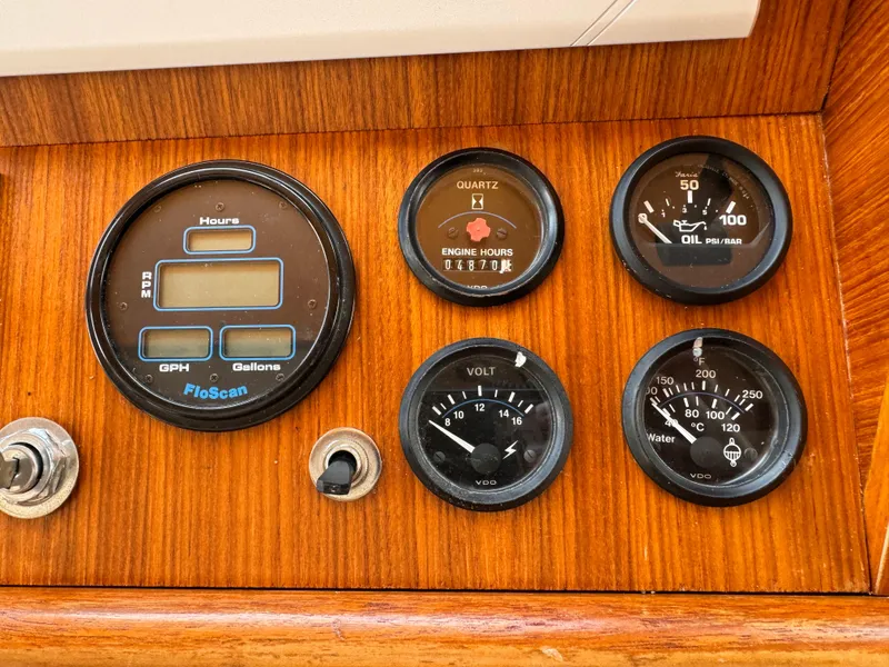 Slide: The Image of Instrument panel of a 1996 Kadey-Krogen 48 boat with various gauges. - 42