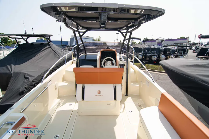 Slide: The Image of 2024 Capoforte CX270 boat interior with helm, seating, and modern design features. - 10