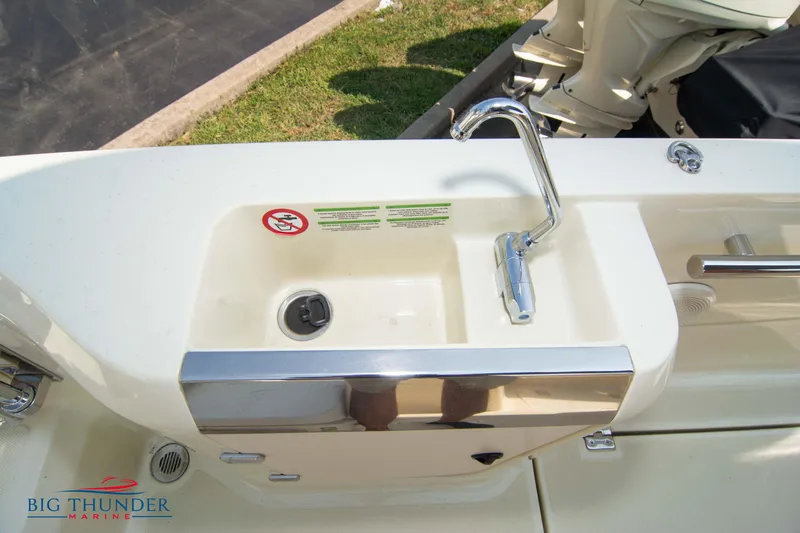 Slide: The Image of 2024 Capoforte CX270 boat sink with faucet and storage compartment. - 13