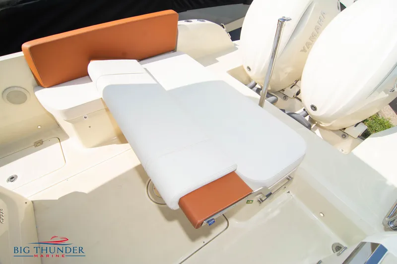 Slide: The Image of 2024 Capoforte CX270 boat interior with white and orange seating, featuring Yamaha engines. - 15