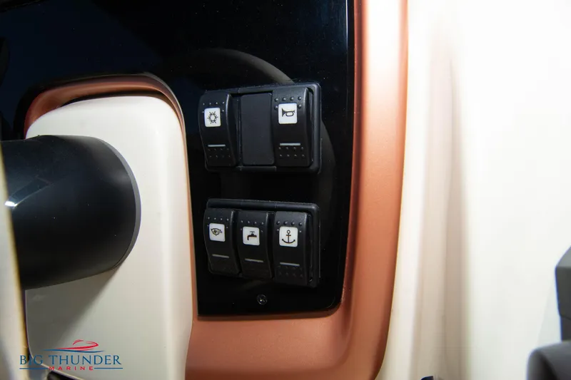 Slide: The Image of Control panel of 2024 Capoforte CX270 boat with various switches. - 24