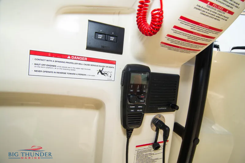 Slide: The Image of 2024 Capoforte CX270 boat dashboard with safety warnings and communication equipment. - 26