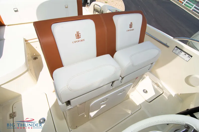 Slide: The Image of 2024 Capoforte CX270 boat seats with white and brown upholstery, featuring Capoforte logo. - 31