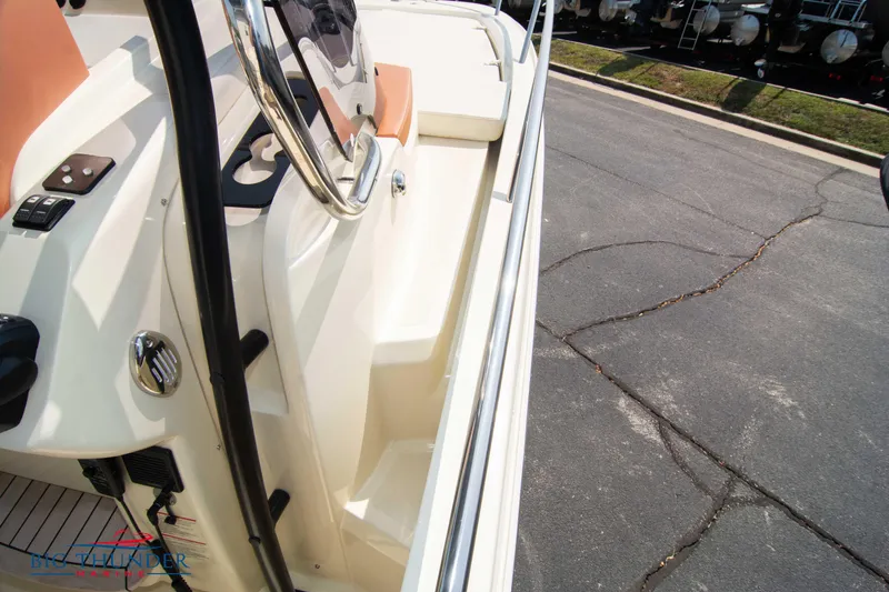 Slide: The Image of 2024 Capoforte CX270 boat interior with steering wheel and seating area. - 33