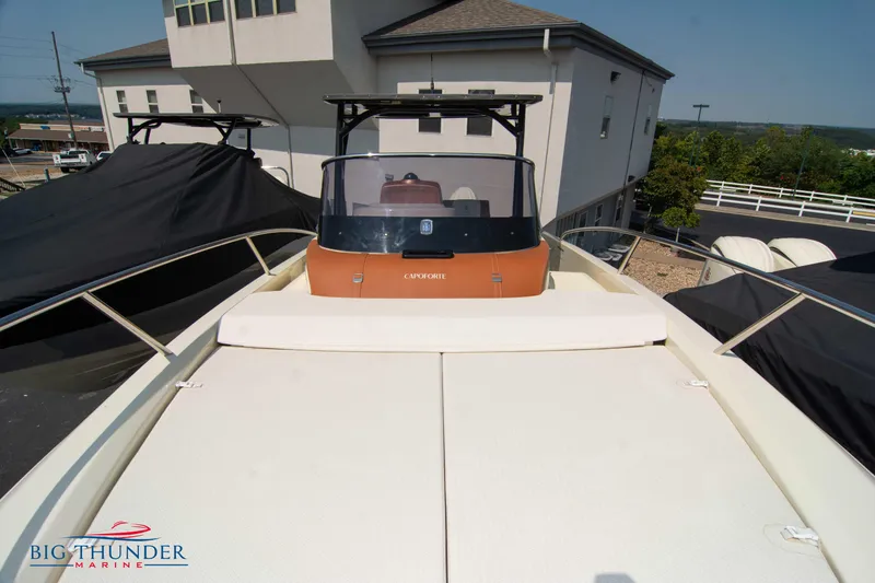 Slide: The Image of 2024 Capoforte CX270 boat with spacious deck, docked at marina. - 39