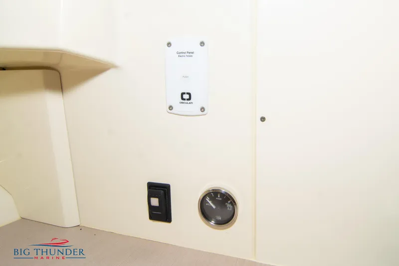 Slide: The Image of 2024 Capoforte CX270 interior panel with gauge and switch, Big Thunder Marine logo. - 45