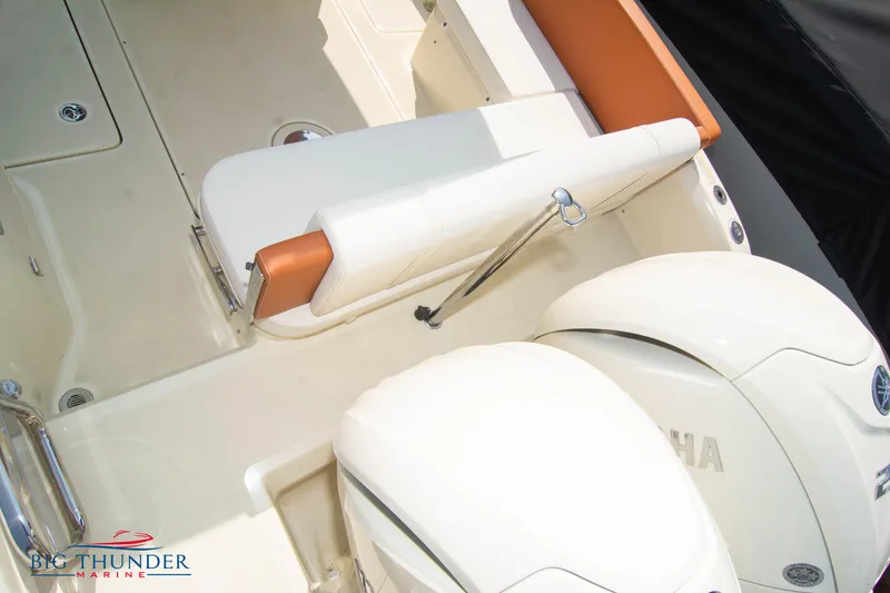 Slide: The Image of 2024 Capoforte CX270 boat interior with Yamaha engines and seating area. - 8