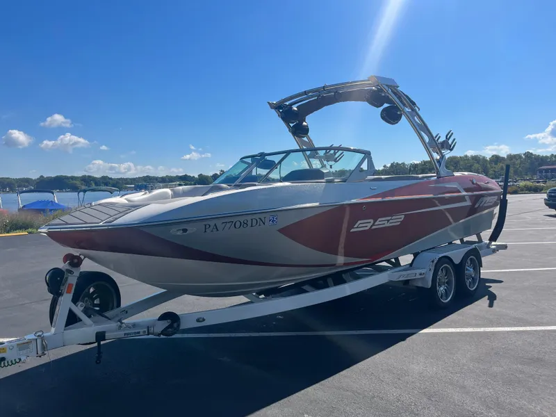Slide: The Image of 2015 MB B52 23 boat on trailer in sunny parking lot. - 11